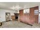 Spacious basement with a brick fireplace, carpet and natural light at 3104 Poplar St, Anderson, IN 46012