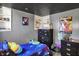 This bedroom features a galaxy-themed bed and curated collection of toys and memorabilia at 3104 Poplar St, Anderson, IN 46012