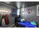 The bedroom features a galaxy-themed bed set, constellation wall art, and unique light fixtures at 3104 Poplar St, Anderson, IN 46012
