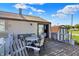 Wooden deck with a white railing features an outdoor dining table and chairs at 3104 Poplar St, Anderson, IN 46012