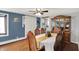 Formal dining room with hardwood floors, china cabinet, and seating for six at 3104 Poplar St, Anderson, IN 46012