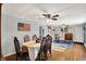 Bright dining room features hardwood floors and an American flag hanging on the wall at 3104 Poplar St, Anderson, IN 46012
