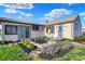 Charming single-story home with a landscaped front yard and a welcoming entryway at 3104 Poplar St, Anderson, IN 46012