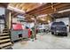 Large garage with stairs, rolling tool chest, boat, and truck at 3104 Poplar St, Anderson, IN 46012