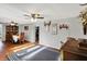Spacious living and dining area with hardwood floors and ample natural light at 3104 Poplar St, Anderson, IN 46012