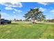 Exterior view of a yard with a large evergreen tree as its focal point at 3104 Poplar St, Anderson, IN 46012