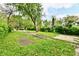 Large backyard featuring mature trees, and a long driveway providing space for outdoor activities at 3109 Forest Manor Ave, Indianapolis, IN 46218