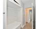 Bright bathroom with a white shower and tub combination adjacent to a linen closet at 3109 Forest Manor Ave, Indianapolis, IN 46218