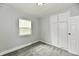 This bedroom offers a sunny window, fresh paint, and a built in closet at 3109 Forest Manor Ave, Indianapolis, IN 46218