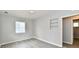 Bright, empty room with light gray walls, new flooring, a window, and a convenient closet at 3109 Forest Manor Ave, Indianapolis, IN 46218
