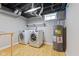 Basement laundry area with a washer, dryer, and water heater at 3421 Arthington Blvd, Indianapolis, IN 46218