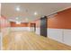 Open basement area with sliding door and vinyl flooring at 3421 Arthington Blvd, Indianapolis, IN 46218