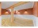 Basement featuring wood beam accents and modern lighting at 3421 Arthington Blvd, Indianapolis, IN 46218