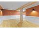 Basement featuring wood beam accents and modern lighting at 3421 Arthington Blvd, Indianapolis, IN 46218