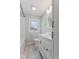Bright bathroom with a single sink vanity and shower/tub combo at 3421 Arthington Blvd, Indianapolis, IN 46218