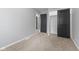 Bedroom featuring neutral carpet, gray walls, and closet at 3421 Arthington Blvd, Indianapolis, IN 46218