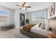 Bedroom featuring neutral carpet, gray walls, ceiling fan, and closet at 3421 Arthington Blvd, Indianapolis, IN 46218