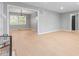 Spacious living room featuring light wood floors, gray walls and an open floor plan at 3421 Arthington Blvd, Indianapolis, IN 46218