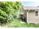 Exterior view of backyard with well-maintained lawn, grill, and string lights at 4406 Carrollton Ave, Indianapolis, IN 46205