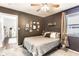 Inviting bedroom features an open doorway, a neutral color scheme, and bright natural light at 4406 Carrollton Ave, Indianapolis, IN 46205