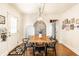 Inviting dining room with wood table, modern chandelier and stylish decor creates an ideal ambiance at 4406 Carrollton Ave, Indianapolis, IN 46205