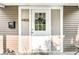 Close-up of the white front door with a wreath and the house number 4406 at 4406 Carrollton Ave, Indianapolis, IN 46205