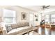 Bright and airy living room with hardwood floors, stylish furnishings, and ample natural light at 4406 Carrollton Ave, Indianapolis, IN 46205