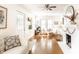 A modern living room with hardwood floors, fireplace, and comfortable seating with natural light at 4406 Carrollton Ave, Indianapolis, IN 46205