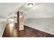 Bright attic with wood floors and exposed brick at 4623 Evanston Ave, Indianapolis, IN 46205