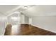 Finished attic featuring hardwood floors, neutral paint, and built in closet storage at 4623 Evanston Ave, Indianapolis, IN 46205