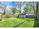 Spacious backyard with detached garage and partial fencing at 4623 Evanston Ave, Indianapolis, IN 46205