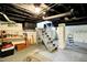 Unfinished basement with utility connections and painted ceiling at 4623 Evanston Ave, Indianapolis, IN 46205