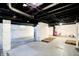 Spacious unfinished basement with painted ceilings and concrete floor at 4623 Evanston Ave, Indianapolis, IN 46205