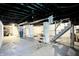 Large unfinished basement with painted ceilings, concrete floor and utilities at 4623 Evanston Ave, Indianapolis, IN 46205