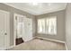 Bedroom with neutral walls and carpet offers access to a bathroom at 4623 Evanston Ave, Indianapolis, IN 46205