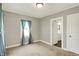 A cozy bedroom with neutral carpet, closet and a full bathroom is conveniently attached at 4623 Evanston Ave, Indianapolis, IN 46205