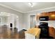 Open kitchen features an island and black appliances for easy meal prep and entertaining at 4623 Evanston Ave, Indianapolis, IN 46205
