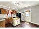 Kitchen with wood cabinets, granite counters and a movable island at 4623 Evanston Ave, Indianapolis, IN 46205