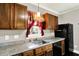 Close-up of the kitchen countertops, sink and cabinets at 4623 Evanston Ave, Indianapolis, IN 46205