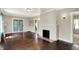 Open living room with a brick fireplace and access to the backyard at 4623 Evanston Ave, Indianapolis, IN 46205