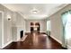 Open-concept living room with hardwood floors, fireplace, and views into the kitchen, blending comfort and style at 4623 Evanston Ave, Indianapolis, IN 46205