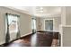 Cozy living room with hardwood floors, large windows and a fireplace at 4623 Evanston Ave, Indianapolis, IN 46205