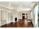 Spacious living room with hardwood floors and a decorative fireplace at 4623 Evanston Ave, Indianapolis, IN 46205