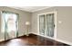 Inviting living area featuring hardwood floors, natural light, and stylish curtains, creating a warm ambiance at 4623 Evanston Ave, Indianapolis, IN 46205
