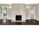 A traditional fireplace serves as a focal point in the spacious living room at 4623 Evanston Ave, Indianapolis, IN 46205