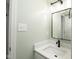 This bathroom features stylish mirror, a sleek black faucet and modern lighting at 4625 Elkhorn Ct, Noblesville, IN 46062