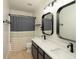 Contemporary bathroom with dual sinks, modern lighting, and stylish tile accents at 4625 Elkhorn Ct, Noblesville, IN 46062