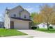 Charming home with a well-maintained lawn, spacious driveway, attached garage, and mature tree in the yard at 4625 Elkhorn Ct, Noblesville, IN 46062