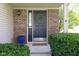 Inviting entryway featuring a blue front door with a decorative wreath and manicured green bushes at 4625 Elkhorn Ct, Noblesville, IN 46062