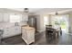 Modern kitchen with white cabinets, butcher block island, stainless steel appliances, and wood-look floors at 4625 Elkhorn Ct, Noblesville, IN 46062